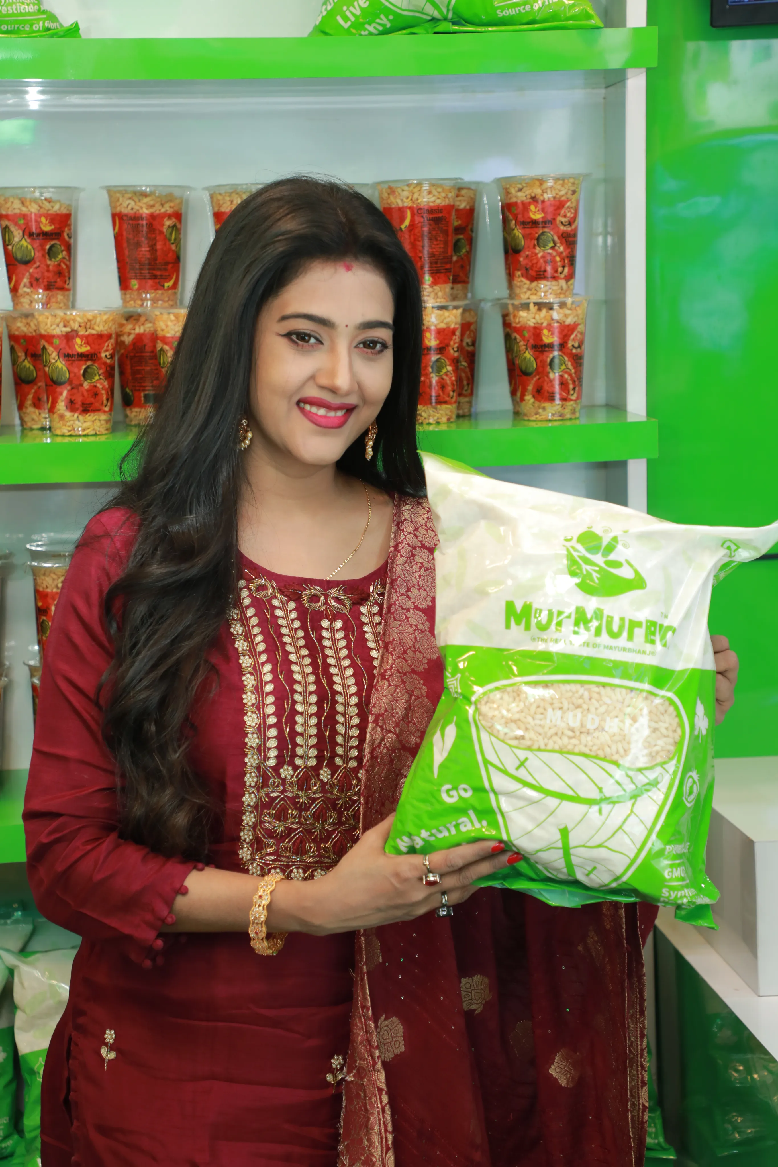 Woman holding green bag